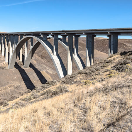 The Fred G. Redmon Bridge, also known as the Selah Creek Bridge, is a monumental concrete arch bridge carrying Interstate 82 across Selah Creek near Selah in Yakima County, Washington. The bridge was an integral part of a 2.8-mile freeway segment of I-82 construction that opened to traffic on November 2, 1971. Commissioned and constructed by renowned engineering firm Peter Kiewit & Sons, the bridge is the longest of its kind in America and is renowned for its height in comparison to other bridges in Washington State. It won Grand Award recognition from the Washington Aggregates and Concrete Association "for excellence in the use of concrete" in 1971.